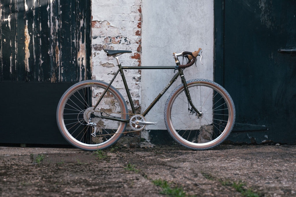 Brother Kepler built up as a touring and gravel bike in the woods