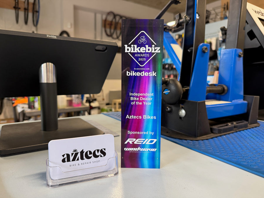 BikeBiz Awards 2025 Independent Bike Dealer of the Year trophy on the Aztecs Bikes workshop bench