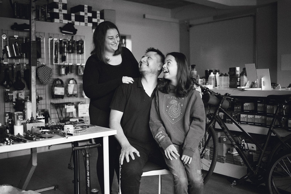 Marco with his family in the Aztecs Bikes workshop in Bow
